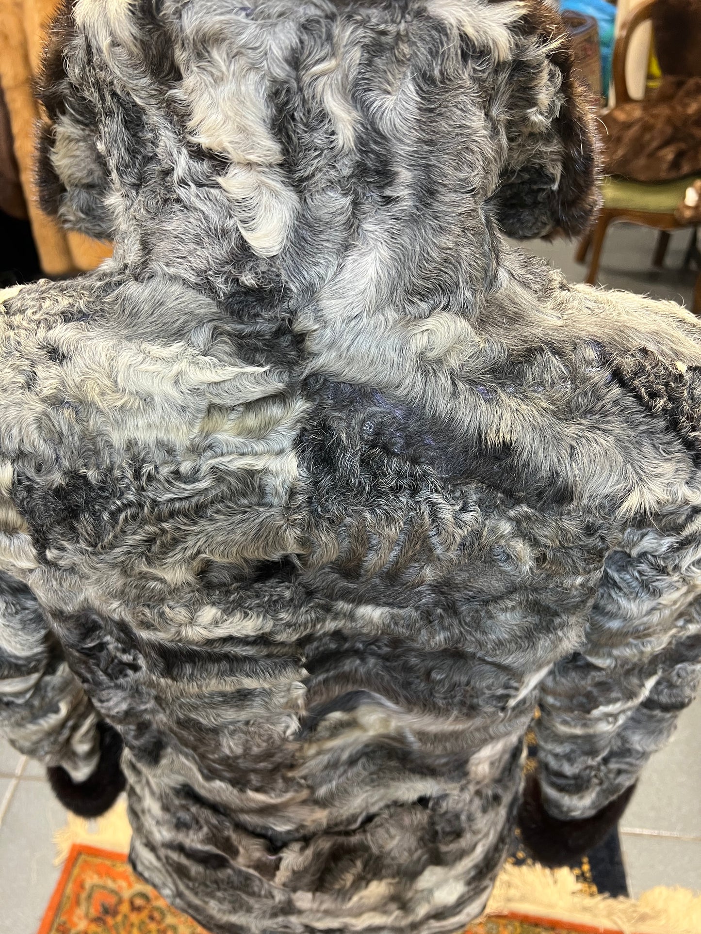 Cape astrakan col et poignée en vison